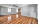 Spacious living room area with wood-look flooring and fresh paint throughout at 4851 W Gandy Blvd # B3 L8, Tampa, FL 33611