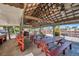 Community picnic area featuring wooden tables and ample seating under a covered pavilion with ceiling fans at 4851 W Gandy Blvd # B3 L8, Tampa, FL 33611