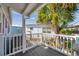 Relaxing porch featuring a white railing and lush greenery in the background at 4851 W Gandy Blvd # B3 L8, Tampa, FL 33611