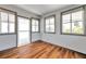 Sunroom with wood-look flooring, multiple windows, and a bright, airy feel at 4851 W Gandy Blvd # B3 L8, Tampa, FL 33611