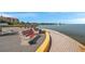 Picturesque waterfront view with benches lining the walkway, ideal for relaxation at 4851 W Gandy Blvd # B3 L8, Tampa, FL 33611