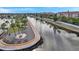 Waterfront view featuring a scenic walkway with palm trees and benches along the water at 4851 W Gandy Blvd # B3 L8, Tampa, FL 33611