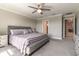 Comfortable bedroom with a ceiling fan, neutral paint, and plush carpet at 6223 Baywood Ct, Bradenton, FL 34211