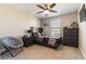 Bedroom with dark wood furniture, ceiling fan, and carpet flooring at 6223 Baywood Ct, Bradenton, FL 34211