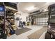 Spacious garage with ample storage, a golf cart, and epoxy flooring at 6223 Baywood Ct, Bradenton, FL 34211