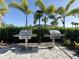 Outdoor community grills ready for use, complete with lush landscaping and beautiful clear skies at 6223 Baywood Ct, Bradenton, FL 34211