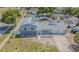 A high-angle view reveals the home's architecture, solar panels, well-kept lawn, and location in a peaceful neighborhood at 7015 Cobblewood Ct, Tampa, FL 33615