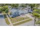 An aerial shot showcasing the home's layout, landscaping, and neighborhood, providing a comprehensive view of the property at 7015 Cobblewood Ct, Tampa, FL 33615