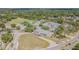 Aerial view of a community school building surrounded by trees and athletic fields at 7015 Cobblewood Ct, Tampa, FL 33615