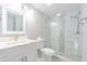 Bathroom with glass enclosed shower and marble countertop at 7015 Cobblewood Ct, Tampa, FL 33615