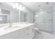 Bathroom features a double sink marble countertop, shower over tub and bright lighting at 7015 Cobblewood Ct, Tampa, FL 33615