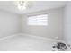 Bedroom with tiled floors and window at 7015 Cobblewood Ct, Tampa, FL 33615