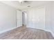 Bedroom featuring laminate floors, double closets, ceiling fan, and neutral walls at 7015 Cobblewood Ct, Tampa, FL 33615