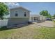 Attractive home featuring a lush green lawn, stone detailing, and an appealing split-level design on a sunny day at 7015 Cobblewood Ct, Tampa, FL 33615