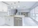 Modern kitchen with marble countertops and stainless steel appliances at 7015 Cobblewood Ct, Tampa, FL 33615
