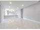 Open floor plan living area with tile flooring at 7015 Cobblewood Ct, Tampa, FL 33615