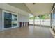Screened patio with tile flooring, perfect for outdoor entertaining and relaxation at 7015 Cobblewood Ct, Tampa, FL 33615