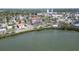 An aerial view shows the building next to a body of water and a mangrove at 7037 Sunset S Dr # 205, South Pasadena, FL 33707
