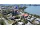 An aerial view shows the building is next to a pool and a tennis court at 7037 Sunset S Dr # 205, South Pasadena, FL 33707
