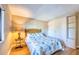 Bedroom showcasing a large closet, tropical bed set, and an accent table at 7037 Sunset S Dr # 205, South Pasadena, FL 33707