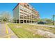 Large condo building with covered parking, offering comfortable living and convenient amenities at 7037 Sunset S Dr # 205, South Pasadena, FL 33707