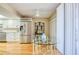 Spacious kitchen leading to dining area with stainless steel refrigerator and appliances at 7037 Sunset S Dr # 205, South Pasadena, FL 33707