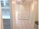 Hallway showcasing a built-in storage unit and closet for optimal space organization at 7430 Sunshine Skyway S Ln # 305, St Petersburg, FL 33711