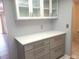 Hallway with extra storage and white shaker cabinets at 7430 Sunshine Skyway S Ln # 305, St Petersburg, FL 33711