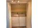 Laundry closet featuring a stacked washer and dryer unit at 7430 Sunshine Skyway S Ln # 305, St Petersburg, FL 33711