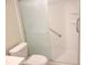Modern bathroom shower with glass door and white subway tile surround at 7430 Sunshine Skyway S Ln # 305, St Petersburg, FL 33711