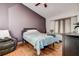 Cozy bedroom featuring a vaulted ceiling, comfortable seating, and a window seat with natural light at 7850 Lake Placid Ln, New Port Richey, FL 34655