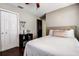 Neutral bedroom offering a ceiling fan, closet, and shelf space at 7850 Lake Placid Ln, New Port Richey, FL 34655