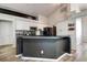Contemporary kitchen with granite countertops, stainless steel appliances, and ample cabinet space at 7850 Lake Placid Ln, New Port Richey, FL 34655