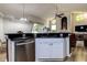 Modern kitchen featuring stainless steel appliances, granite countertops and an open concept layout at 7850 Lake Placid Ln, New Port Richey, FL 34655
