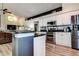 Modern kitchen with stainless steel appliances, granite countertops, island and stylish backsplash at 7850 Lake Placid Ln, New Port Richey, FL 34655