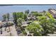 Community aerial view overlooking parking, pool, and lake access at 90 S Highland Ave # 6, Tarpon Springs, FL 34689