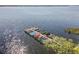 Lake view featuring a dock with multiple boats for lake activities at 90 S Highland Ave # 6, Tarpon Springs, FL 34689