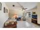 Cozy bedroom with tiled floors, ceiling fan, and a window offering natural light at 90 S Highland Ave # 6, Tarpon Springs, FL 34689