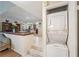 Interior view of home featuring dining room, kitchen, split-level design and a stackable washer-dryer at 90 S Highland Ave # 6, Tarpon Springs, FL 34689