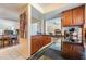 Functional kitchen with wood cabinets, granite countertops, and stainless steel appliances at 90 S Highland Ave # 6, Tarpon Springs, FL 34689