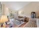 Comfortable living room with a fireplace, sliding doors, and neutral color palette at 90 S Highland Ave # 6, Tarpon Springs, FL 34689