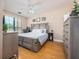 Comfortable bedroom with hardwood floors and large window at 2709 Via Cipriani # 522B, Clearwater, FL 33764