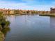Picturesque waterfront featuring colorful buildings and paddle boarders on a serene canal at 2709 Via Cipriani # 522B, Clearwater, FL 33764