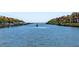 Scenic waterfront view showcasing a tranquil waterway with boat docks and lush vegetation at 2709 Via Cipriani # 522B, Clearwater, FL 33764
