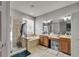 Bathroom featuring a walk-in shower, soaking tub, and double vanity at 10229 Avelar Ridge Dr, Riverview, FL 33578