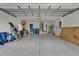 Spacious garage with ample storage space and overhead lighting at 10229 Avelar Ridge Dr, Riverview, FL 33578