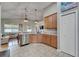 Modern kitchen featuring stainless steel appliances, granite countertops, and ample cabinet space at 10229 Avelar Ridge Dr, Riverview, FL 33578