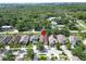 Aerial view showcasing a residential neighborhood with tree-lined streets and well-maintained homes at 10229 Avelar Ridge Dr, Riverview, FL 33578