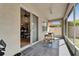Screened patio featuring outdoor seating and view of kitchen at 10229 Avelar Ridge Dr, Riverview, FL 33578