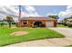 Charming single-story home with well-manicured lawn and attached garage at 10601 42Nd N Ct, Clearwater, FL 33762